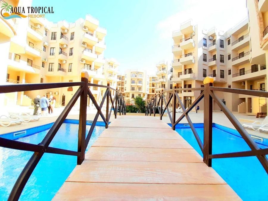 Aqua Tropical Resort — the timber bridge across the pool